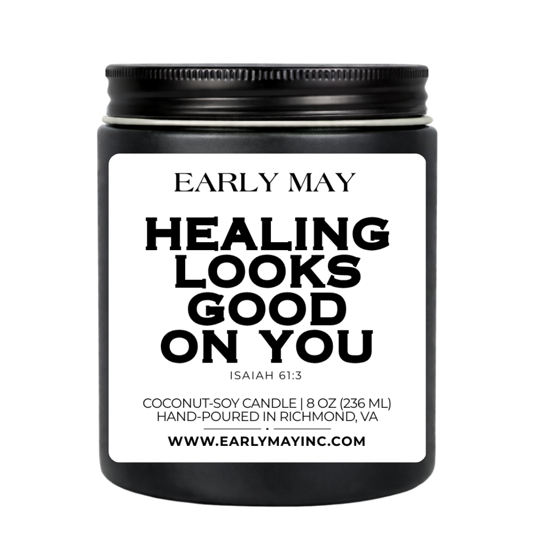 Black candle jar with 'Early May' branding and text on a white background