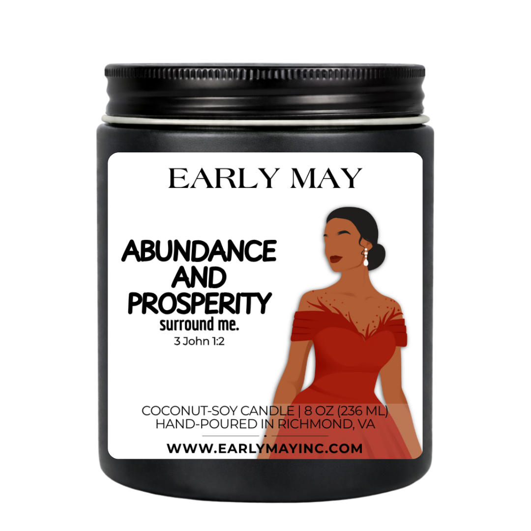 Black candle jar with a label featuring a woman in a red dress and 'Early May' branding.