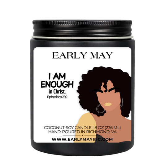 Black candle jar with a label featuring a woman's silhouette and text, branded 'Early May'.