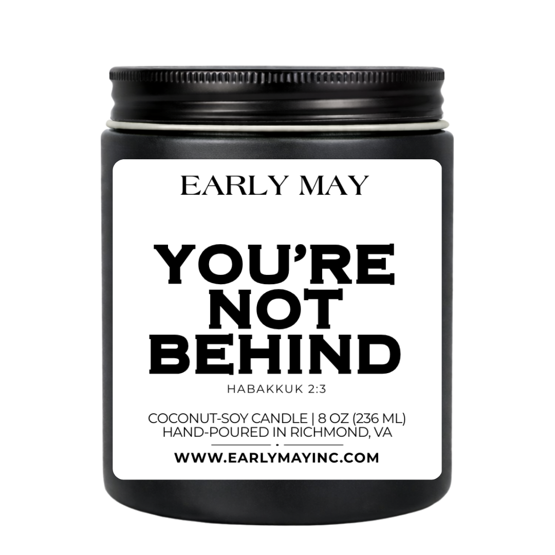 Black candle jar with white label featuring 'Early May' and text
